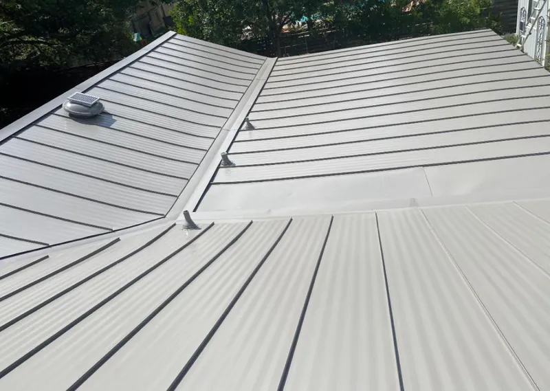 Solar attic fan installed on a metal roof for Roof Ventilation in Cypress Lake